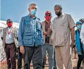  ?? NARIMAN EL-MOFTY/AP ?? Officials visit a refugee camp Saturday in Qadarif, Sudan, of people who fled fighting in Ethiopia's Tigray region.