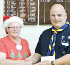  ??  ?? Lions President Alan Smith presents a cheque for $1200 to Rick Bradley from Trafalgar Scouts