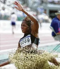  ?? Associated Press file ?? Dawn Burrell competes at the Olympic track and field trials in 2000. Injuries ended her athletic career in 2008.