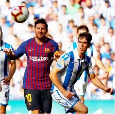  ??  ?? Barcelona’s Lionel Messi (left) in La Liga action against Real Sociedad at Anoeta Stadium, San Sebastian, Spain in this file photo. — Reuters photo