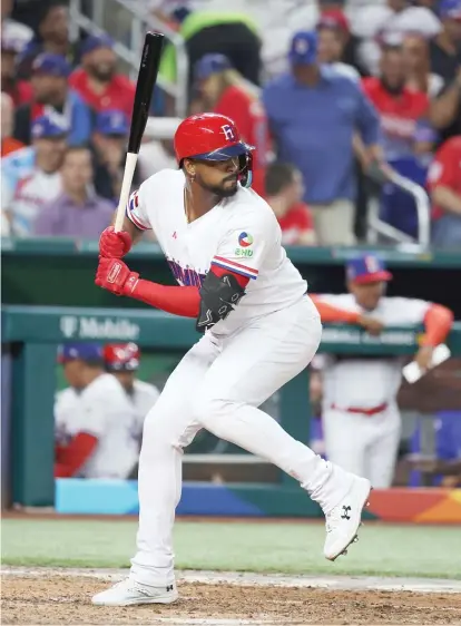  ?? AL BELLO/GETTY IMAGES ?? Eloy Jimenez (batting for the Dominican Republic on Wednesday) is putting in extra time with Sox coaches this spring.