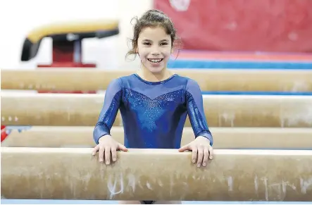  ?? — MICHELLE BERG FILES ?? Eleven-year-old Sienna Forsberg is a top-level gymnast (Level 7 of 10 in the Junior Olympics program) at the Marion club, despite having FAS, ADHD and other intellectu­al disabiliti­es.