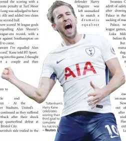  ?? — Reuters ?? Tottenham’s Harry Kane celebrates scoring their third goal to complete his hat-trick.