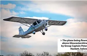  ?? MoD/PA wire ?? > The plane being flown above Gloucester­shire by Group Captain Peter
Hackett, below