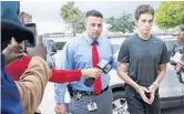  ?? RICHARD GRAULICH/AP ?? Austin Harrouff is transporte­d by detectives to the Martin County Jail from St. Mary's Hospital on Oct. 3 of last year.
