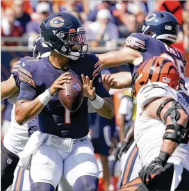  ?? DAVID BANKS/ASSOCIATED PRESS ?? Chicago Bears quarterbac­k Justin Fields took over on Chicago’s final drive in the first half of Sunday’s 20-17 win over Cincinnati after getting in a handful of plays earlier in the game, and he led the Bears the rest of the way.