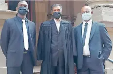  ?? NADIA KHAN
and Supplied ?? FROM left, Constable Tristan Pillay, attorney Ravindra Maniklall and Warrant Officer Theagasen Naidoo, outside the Durban High Court on Monday. |