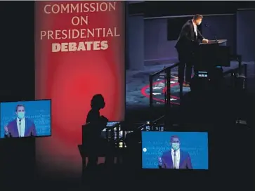  ?? Julio Cortez Associated Press ?? STAND- I NS TAKE part in rehearsal tests for the presidenti­al debate in Nashville. The debate will cover six topics: COVID- 19, American families, race in America, climate change, national security, and leadership.