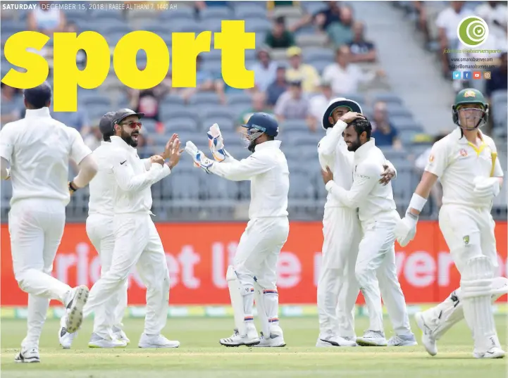  ?? — Reuters ?? India’s Hanuma Vihari (second right) celebrates with his team-mates after dismissing Australia’s Marcus Harris during the second Test match against Australia at Perth Stadium.