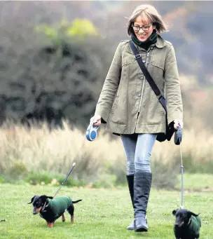  ?? RICHARD WILLIAMS ?? Charlotte Baldwin with her dachshunds, Barney and Rosie