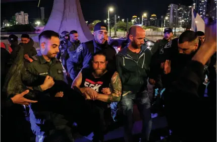  ?? AFP PHOTO ?? ANGRY AT BIBI
Police forcibly remove protesters from an anti-government demonstrat­ion in the city of Tel Aviv, western Israel, on
Saturday, March 16, 2024.