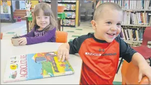  ?? DESIREE ANSTEY/TC MEDIA ?? Maya Arsenault and Luke Gallant plant seeds at Abram-Village Public Library, all in support of Canadian Agricultur­e Awareness Month.