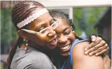  ?? STAFF PHOTO BY ANGELA LEWIS FOSTER ?? Demetrus Coonrod, right, gets a hug Tuesday from Loretta Nunn while celebratin­g her win over incumbent City Councilman Yusuf Hakeem.