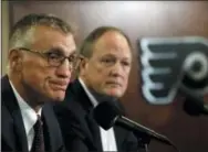  ?? MATT ROURKE — THE ASSOCIATED PRESS ?? Flyers President Paul Holmgren, left, and Comcast Spectacor Chairman and CEO Dave Scott take part in a news conference Tuesday in Philadelph­ia, the day after the club fired general manager Ron Hextall.