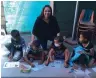  ?? ?? MARILYN Jones with the children during the after-care programme. l SUPPLIED