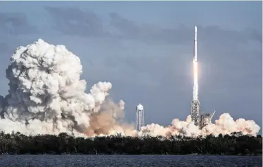  ?? PICTURE: EPA-EFE ?? TAKING FLIGHT: The SpaceX’s Falcon Heavy rocket, the biggest since the Apollo era, takes off from Cape Canaveral in Florida, US, watched by thousands of people.