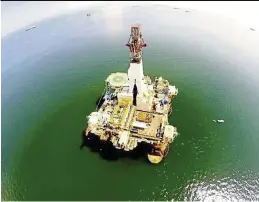  ??  ?? A photo shot from a drone while it’s being used to inspect an oil rig in Labuan. — dragonfly robotix