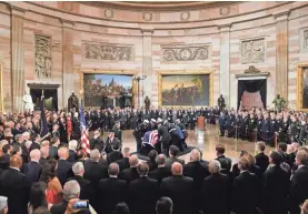  ?? JACK GRUBER/USA TODAY ?? President George H.W. Bush lies in state at the U.S. Capitol Rotunda before a state funeral to be held Wednesday at the National Cathedral.