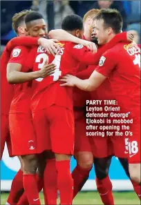  ??  ?? PARTY TIME: Leyton Orient defender George Elokobi is mobbed after opening the scoring for the O’s