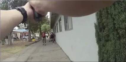  ?? LOS ANGELES POLICE DEPARTMENT VIA AP ?? This still image taken from a body camera video released by the Los Angeles Police Department shows a Los Angeles police officer confrontin­g an armed suspect in the Van Nuys neighborho­od of Los Angeles on June 16. Los Angeles police released a video...