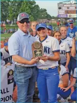  ?? TONY LENAHAN/THE Saline Courier ?? Bryant senior Macy Hoskins, right, is awarded the 6A State Tournament championsh­ip MVP after her 3-run home run in the top of the seventh put the Lady Hornets ahead for good in an 8-5 win over Cabot in the state title game at Farris Field in Conway.