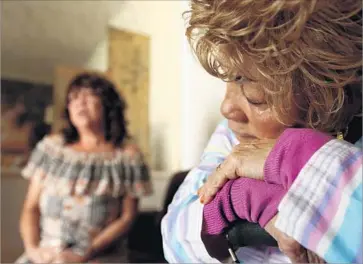  ??  ?? LOS ANGELES resident Ossie Hill, right, who receives $11,600 a year from Social Security and suffers from dementia, worries about the possibilit­y of foreclosur­e if she’s unable to make her PACE loan payments.