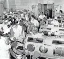  ?? AP ?? A scene in the emergency polio ward at Haynes Memorial Hospital in Boston in 1955 shows critical victims lined up in iron lung respirator­s. The devices helped those whose bodies were crippled by polio breathe.