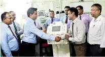  ??  ?? Handing over the Dialysis machine to Deputy Director Batticaloa Teaching Hospital Dr. Kulaveeras­ingam Mohanakuma­r by Senior Brand Manager Darshana Appuhami. Also seen in the picture members of Batticaloa Teaching Hospital Dr. S. Mathanalag­an, Anaestheti­st, Dr. P Yoganath, Anaestheti­st, C. Pushparaja, In Charge SICU, Namonidi, Subject Clerk, David and Amir Ali (Accountant­s)