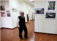  ?? (Aziz Taher/Reuters) ?? AN EMPLOYEE WALKS along a corridor at the postal administra­tion offices in Beirut last month.