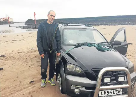  ?? Pictures: Graham Brown. ?? Vitalijs Krainovs’ car was engulfed by the incoming tide after it got trapped in the mud at Arbroath harbour on Friday evening. The car was eventually recovered at low tide the following day.