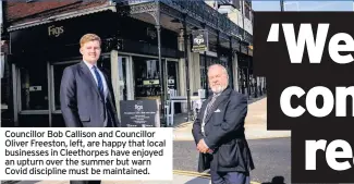  ??  ?? Councillor Bob Callison and Councillor Oliver Freeston, left, are happy that local businesses in Cleethorpe­s have enjoyed an upturn over the summer but warn Covid discipline must be maintained.