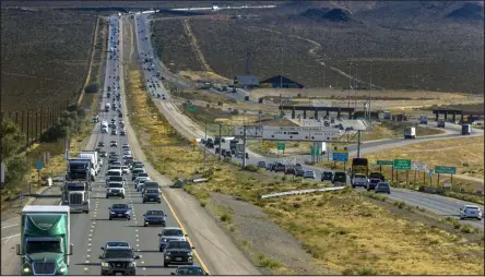  ?? L.E. Baskow
Las Vegas Review-journal @Left_eye_images ?? Holiday weekend traffic can back up more than 20 miles from Primm toward the Las Vegas Valley. A new expansion project will open up a third lane on Interstate 15 during high traffic times.