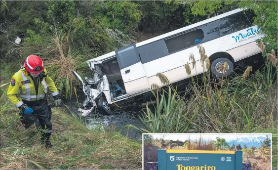  ??  ?? SHOCK RIDE: The crashed bus lies nose-first in the stream off State Highway 47 after it crossed the highway and ran off the road.
PHOTO/ JOHN CHAPMAN