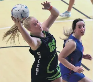  ?? PHOTO: GREGOR RICHARDSON ?? My ball . . . College attacker Ivy McLean grabs the ball watched by Uni Albion A defender Bree Andrews at the Edgar Centre on Saturday.