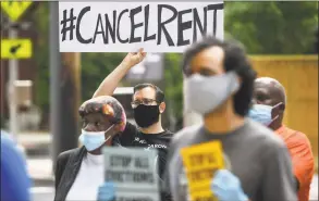  ?? Hearst Connecticu­t Media file photo ?? Members of the Cancel Rent Coalition and residents during a press conference in New Haven on June 18.