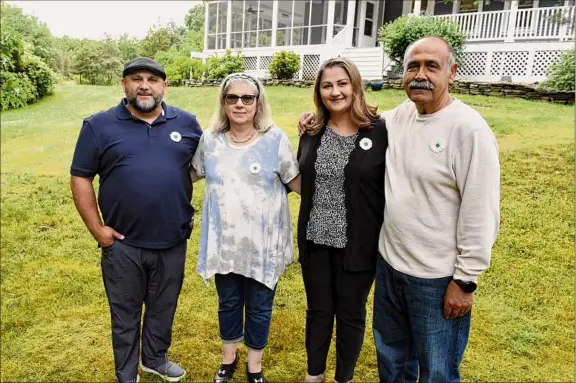  ?? Will Waldron / Times Union ?? Alma Kanic-franco, second from right, with her parents Medina, center, and Sakib Kanic, right, and her brother, Sado Kanic, at her parents’ home in Glenmont. Alma and her family fled Bosnia in the mid-1990s. They were in refugee camps in Germany and arrived in the U.S., also as refugees, in ’98.