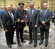  ??  ?? From left, Detective Cpl. Thomas Leahan stands with Pottstown Police Chief Richard Drumheller, Montgomery County District Attorney Kevin Steele and Sgt. Edward Kropp after receiving the Multi-Unit Citation award.