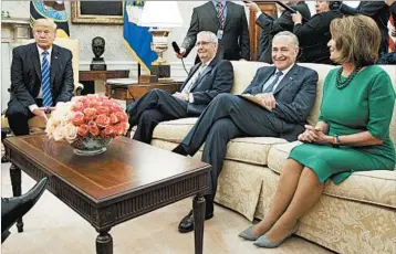  ?? EVAN VUCCI/AP ?? President Donald Trump meets with Senate Majority Leader Mitch McConnell, from left, Senate Minority Leader Chuck Schumer, House Minority Leader Nancy Pelosi and other high-level congressio­nal officials Wednesday in the Oval Office.