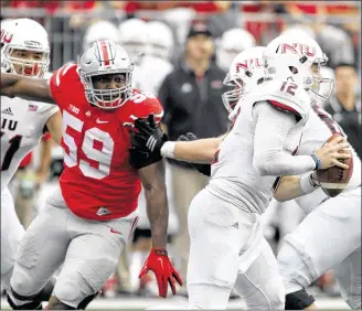  ?? DAVID JABLONSKI / STAFF ?? Ohio State defensive end Tyquan Lewis (chasing Northern Illinois QB Drew Hare last season) said that Buckeyes Nation will be “riled up” for the opener Saturday against Bowling Green.