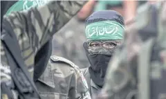  ?? AFP ?? Masked youth cadets march in the southern Gaza Strip city of Khan Yunis on Friday.