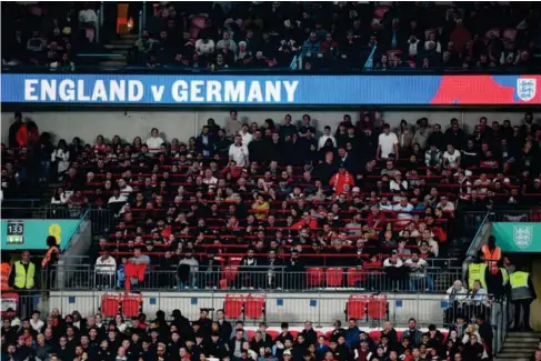  ?? (Getty) ?? Fans watch on from a safe standing section at Wemb l ey during an Eng l and match l ast September