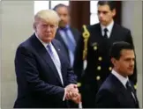  ?? REUTERS / HENRY ROMERO ?? US Republican presidenti­al nominee Donald Trump and Mexico’s President Enrique Pena Nieto arrive for a press conference at the Los Pinos residence in Mexico City on Wednesday.
