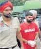  ?? HT ?? Punjab Police taking away Jaggu Bhagwanpur­ia to Mansa after getting his one-day transit remand from a Delhi court.