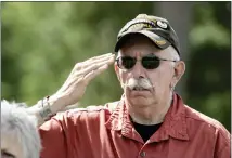  ?? ?? Saluting during the playing of the national anthem is Army National Guard veteran Joe Young.