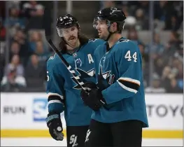  ?? NHAT V. MEYER — BAY AREA NEWS GROUP, FILE ?? The Sharks’ Erik Karlsson talks with teammate Marc-Edouard Vlasic (44) during a game in 2019. The two players will be hugely important to San Jose’s success in 2021.