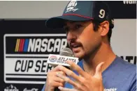  ?? The Associated Press ?? ■ Driver Chase Elliott speaks to the media during a weather delay Saturday before qualifying for the NASCAR Cup Series race at Atlanta Motor Speedway in Hampton, Ga.