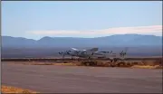  ??  ?? Virgin Galactic’s SpaceShip Two Unity, attached to a carrier jet, takes off Saturday in southern New Mexico. (AP/Virgin Galactic)