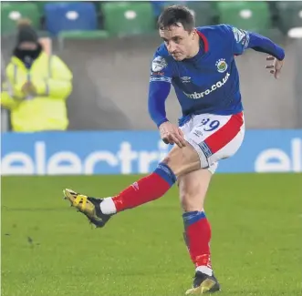  ??  ?? First Joel: Linfield winger Joel Cooper fires home the opening goal against Dungannon Swifts