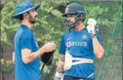  ?? BURHAAN KINU/HT ?? ■ Shikhar Dhawan (right) speaks to India batting coach Vikram Rathour during a practice session on Saturday.