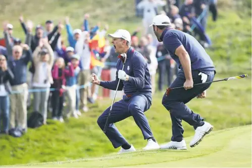  ?? Christian Petersen/Getty Images ?? Justin Rose of Europe celebrates chipping in on the 12th hole in the morning fourball matches at Le Golf National in France.
